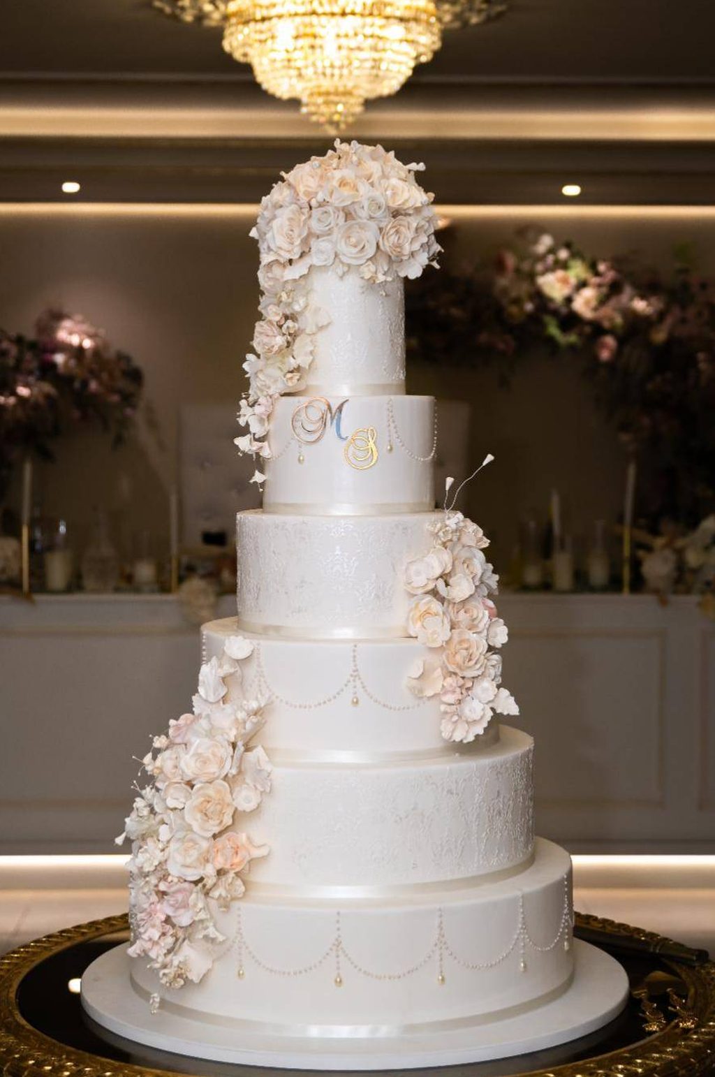 A real Nelly's Cakes royal wedding cake, design Royal 015, in a gilded ballroom